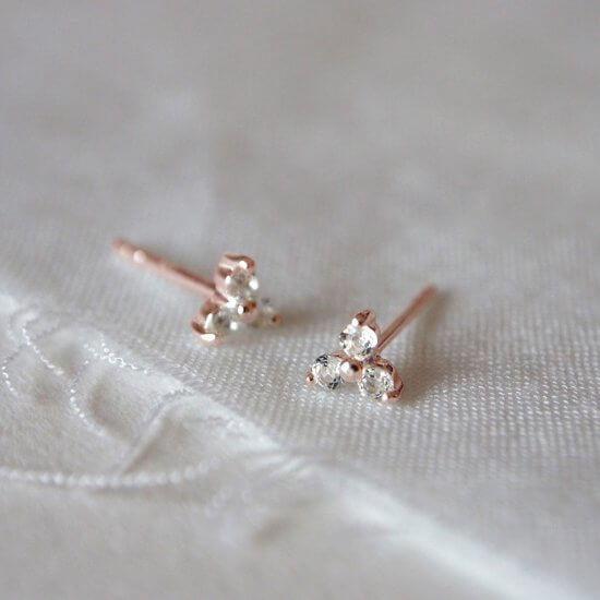 Murkani Trinity Stud Earrings With White Topaz In Rose Gold Plate
