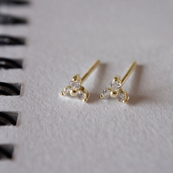Murkani Trinity Stud Earrings With White Topaz In 18 KT Yellow Gold Plate