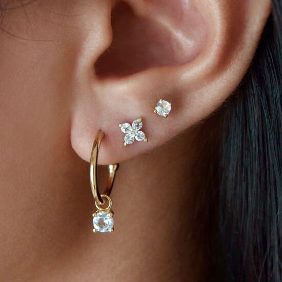 Murkani Clover Stud Earrings With White Topaz In 18 KT Yellow Gold Plate