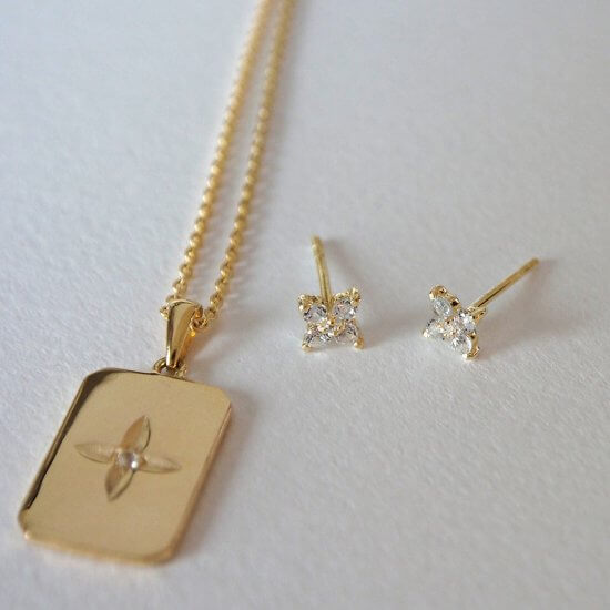 Murkani Clover Stud Earrings With White Topaz In 18 KT Yellow Gold Plate